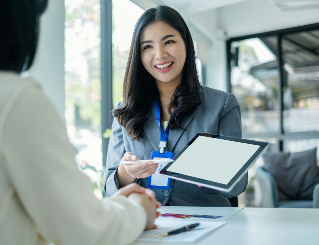Asian Business Customer Service Representatives Work And Smile Serve Sell Credit Card To Customers 1 2.jpg